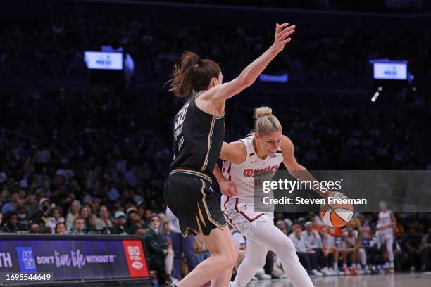 Elena Delle Donne of the Washington Mystics drives to the basket while Breanna Stewart of the New York Liberty plays defense on September 10, 2023 in...