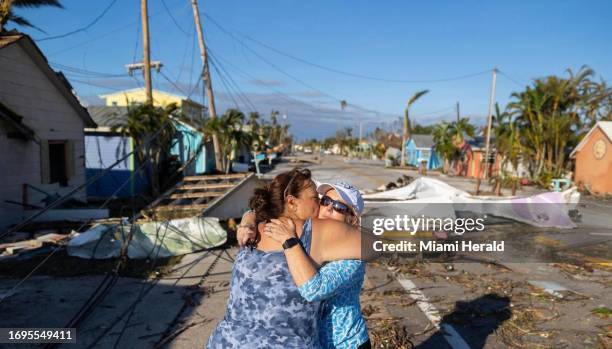 Donna LaMountain embraces her friend, Tammey Lynch after looking at damage on Pine Island Road on Thursday, Sept. 29 in Matlacha, Fla. Hurricane Ian...