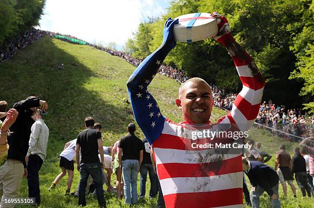 Colorada Springs-based American, Kenny Rackers celebrates winning the first race at Cooper's Hill during the annual Bank Holiday tradition of...