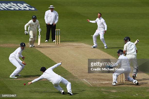 Ian Bell of England dives but narrowly fails to catch Ross Taylor of New Zealand off the bowling of Graeme Swann during day four of the 2nd Investec...