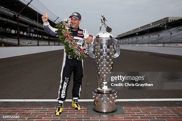 Indianapolis 500 Champion Tony Kanaan of Brazil, driver of the Hydroxycut KV Racing Technology-SH Racing Chevrolet, poses with the Borg Warner Trophy...