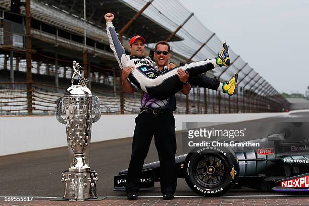 Indianapolis 500 Champion Tony Kanaan of Brazil, driver of the Hydroxycut KV Racing Technology-SH Racing Chevrolet, is carried by Kyle Sagan as they...