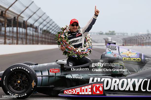 Indianapolis 500 Champion Tony Kanaan of Brazil, driver of the Hydroxycut KV Racing Technology-SH Racing Chevrolet, sits in his car as he poses at...