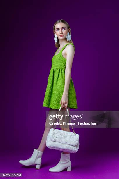 fashionable woman on plain background - shoe boot stock pictures, royalty-free photos & images