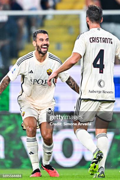 Bryan Cristante of Roma celebrates with his team-mate Leonardo Spinazzola after scoring a goal during the Serie A TIM match between Genoa CFC and AS...