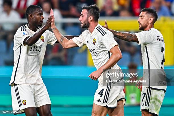 Bryan Cristante of Roma celebrates with his team-mates Evan N'Dicka and Lorenzo Pellegrini after scoring a goal during the Serie A TIM match between...