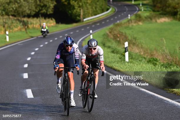 Dylan Teuns of Belgium and Team Israel - Premier Tech and Marc Hirschi of Switzerland and UAE Team Emirates compete in the chase group during the...