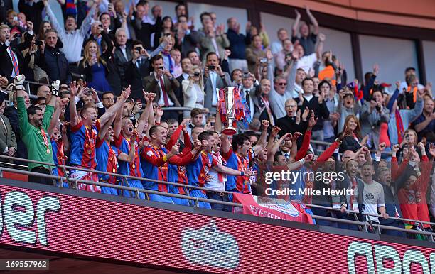 The Crystal Palace players celebrate with the trophy following their victory in extra-time during the npower Championship Play-off Final match...
