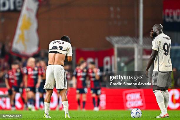Paulo Dybala and Romelu Lukaku of Roma react with disappointment after Mateo Retegui of Genoa has scored a goal during the Serie A TIM match between...