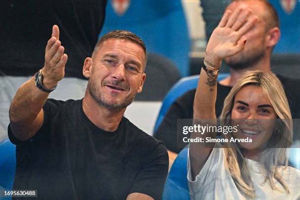 Francesco Totti, former captain of Roma , and his girlfriend Noemi Bocchi joke with photographers prior to kick-off in the Serie A TIM match between...