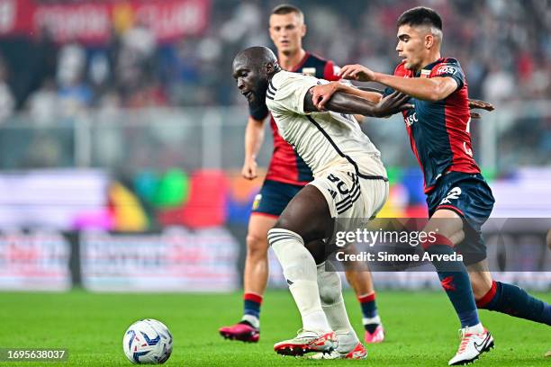 Romelu Lukaku of Roma tries to run past Albert Gudmundsson and Johan Vasquez of Genoa during the Serie A TIM match between Genoa CFC and AS Roma at...