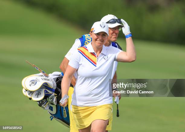 Gemma Dryburgh of The European Team reacts to her second shot on the ninth hole in her match with Madelene Sagstrom against Rose Zhang and Megan...