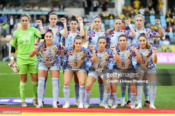 Players of Spain hold up their wrists to display a message that reads SeAcabo in protest prior to the UEFA Women's Nations League match between...
