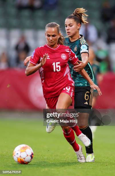 Frederikke Thogersen of Denmark is challenged by Lena Oberdorf of Germany during the UEFA Women's Nations League match between Denmark and Germany at...