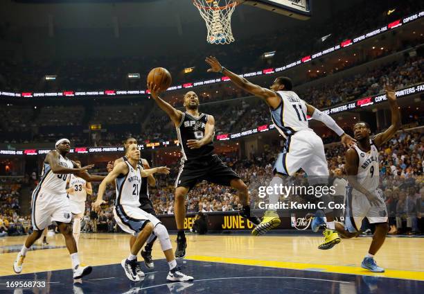 Tony Parker of the San Antonio Spurs goes up for a shot against Mike Conley of the Memphis Grizzlies in the first quarter during Game Four of the...