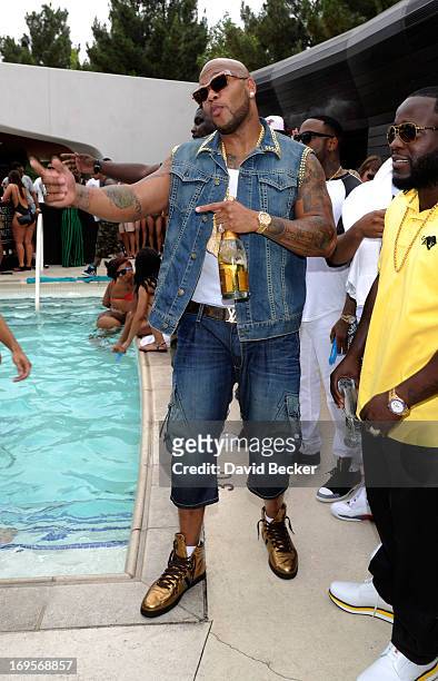 Recording artist Flo Rida appears at the Liquid Pool Lounge at the Aria Resort & Casino at CityCenter on May 27, 2013 in Las Vegas, Nevada.