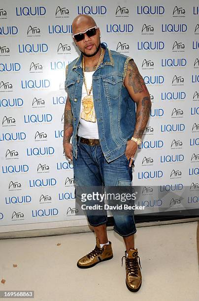 Recording artist Flo Rida arrives at the Liquid Pool Lounge at the Aria Resort & Casino at CityCenter on May 27, 2013 in Las Vegas, Nevada.