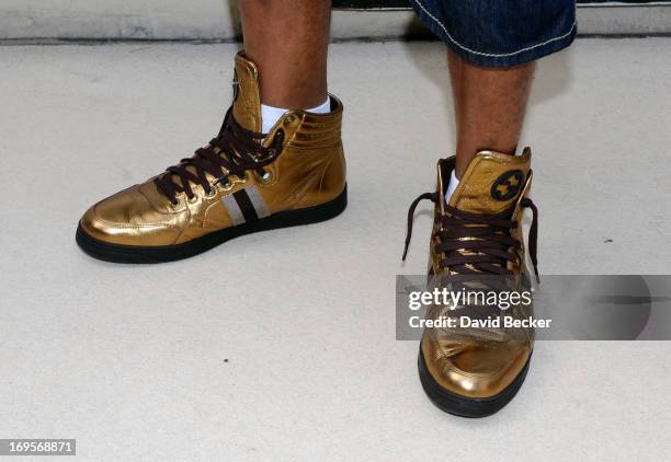 Recording artist Flo Rida arrives at the Liquid Pool Lounge at the Aria Resort & Casino at CityCenter on May 27, 2013 in Las Vegas, Nevada.