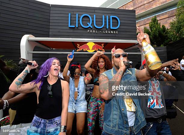 Recording artist Flo Rida and singer Stayc Reign perform at the Liquid Pool Lounge at the Aria Resort & Casino at CityCenter on May 27, 2013 in Las...