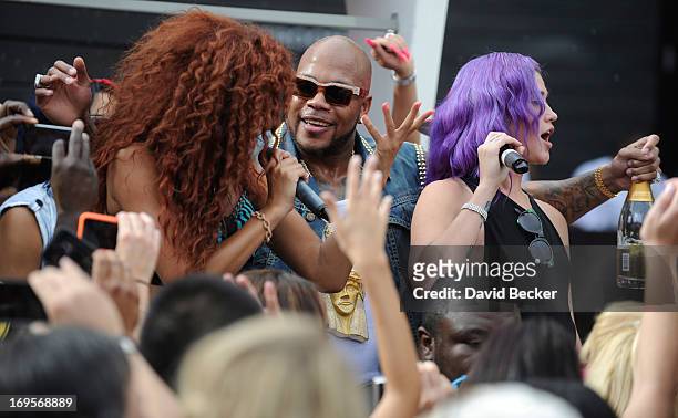 Recording artist Flo Rida and singer Stayc Reign perform at the Liquid Pool Lounge at the Aria Resort & Casino at CityCenter on May 27, 2013 in Las...