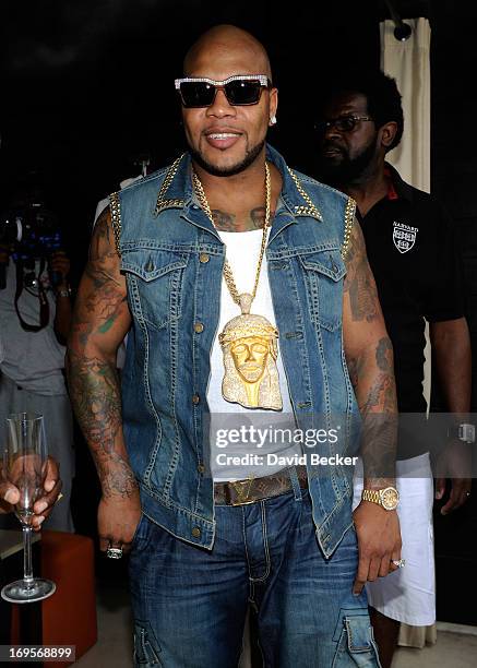 Recording artist Flo Rida appears at the Liquid Pool Lounge at the Aria Resort & Casino at CityCenter on May 27, 2013 in Las Vegas, Nevada.