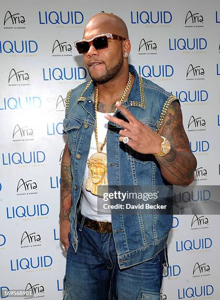 Recording artist Flo Rida arrives at the Liquid Pool Lounge at the Aria Resort & Casino at CityCenter on May 27, 2013 in Las Vegas, Nevada.