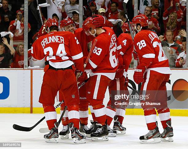 Joakim Andersson of the Detroit Red Wings celebrates his second period goal with Carlo Colaiacovo, Jakub Kindl, Gustav Nyquist and Damien Brunner...