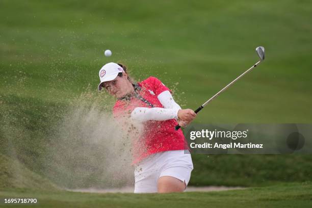 Ally Ewing of Team USA plays a shot from a bunker on the 15th hole during Day One of The Solheim Cup at Finca Cortesin Golf Club on September 22,...