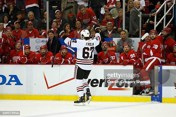 Michael Frolik of the Chicago Blackhawks celebrates his third period penalty shot goal while scaring in front of the Detroit Red Wings bench in Game...