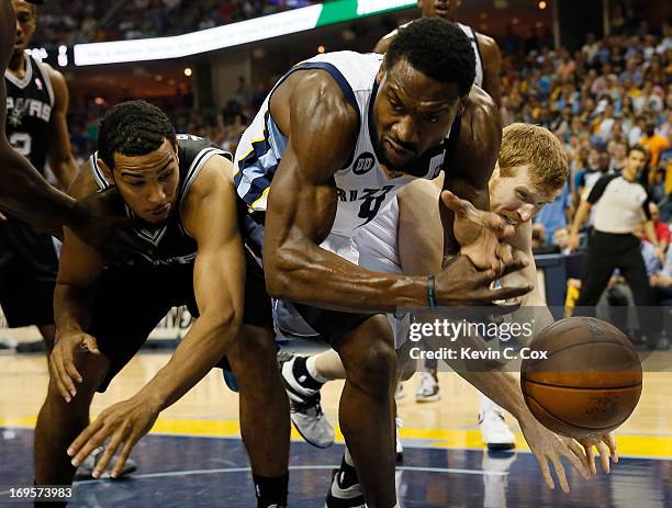 Tony Allen of the Memphis Grizzlies goes for the ball between Cory Joseph and Matt Bonner of the San Antonio Spurs in the second half during Game...