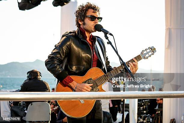 Performs on stage at 'Le Grand Journal' TV show at the 66th Annual Cannes Film Festival on May 20, 2013 in Cannes, France.