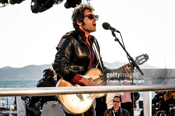 Performs on stage at 'Le Grand Journal' TV show at the 66th Annual Cannes Film Festival on May 20, 2013 in Cannes, France.