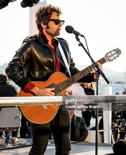 Performs on stage at 'Le Grand Journal' TV show at the 66th Annual Cannes Film Festival on May 20, 2013 in Cannes, France.