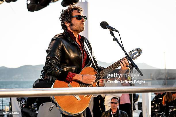 Performs on stage at 'Le Grand Journal' TV show at the 66th Annual Cannes Film Festival on May 20, 2013 in Cannes, France.