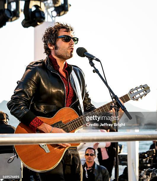 Performs on stage at 'Le Grand Journal' TV show at the 66th Annual Cannes Film Festival on May 20, 2013 in Cannes, France.