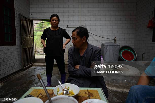 China-labour-health-social,FEATURE by Carol Huang This photo taken on April 29, 2013 shows former construction worker and pneumoconiosis sufferer Xu...