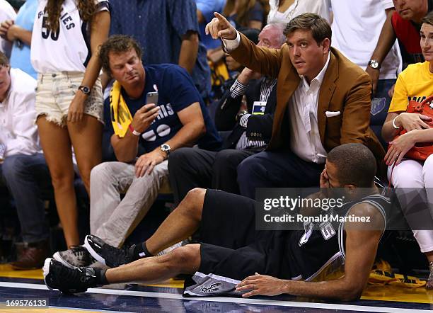 Tony Parker of the San Antonio Spurs reacts after injuring his eye in front of Peter J. Holt in the fourth quarter against the Memphis Grizzlies...