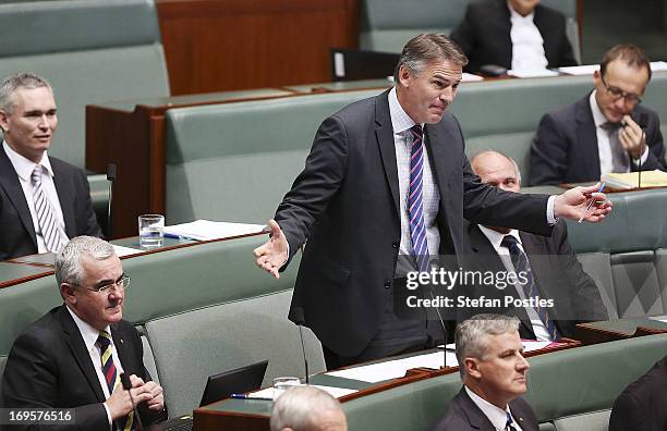 Independent Rob Oakeshott gestures during House of Representatives question time on May 28, 2013 in Canberra, Australia. Prime Minister Gillard today...