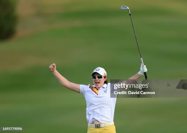Leona Maguire of The European Team celebrates holing her fourth shot on the 18th hole for a match winning birdie in her match with Georgia Hall...