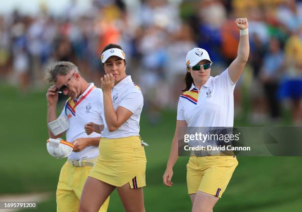 Leona Maguire of The European Team celebrates with her partner Georgia Hall after holing her fourth shot on the 18th hole for a match winning birdie...