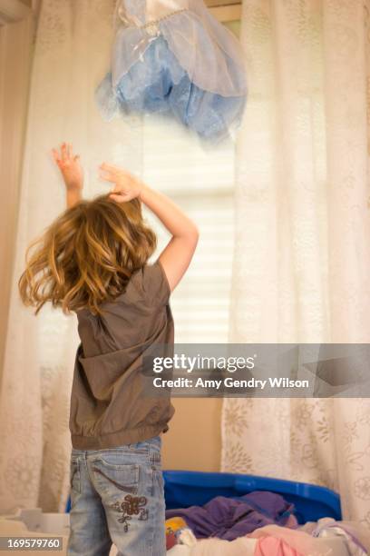 Girl Finds Dress In Toy Box, Foto de stock