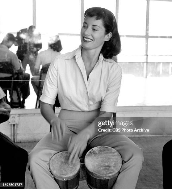 Nancy Hadley, CBS television actress. She takes time away from the camera to learn to play bongo drums. She portrays Marilee Dorf in the TV comedy...