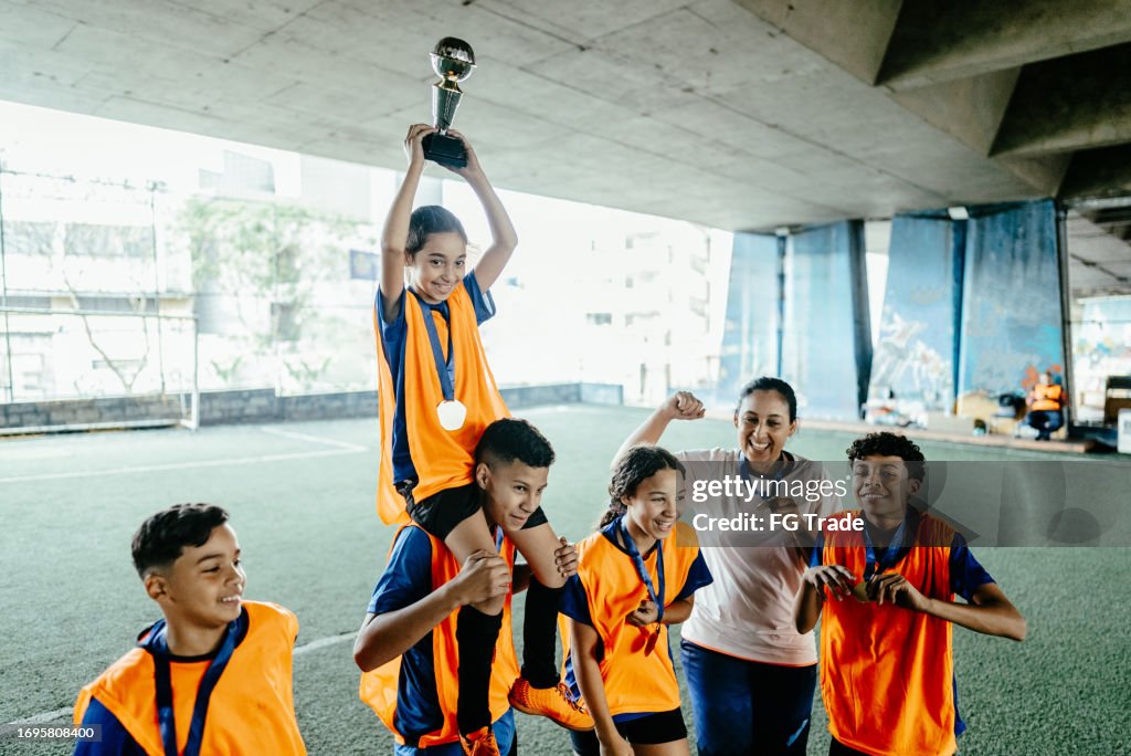 Soccer team celebrating after win the soccer championship