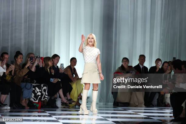 Fashion designer Donatella Versace acknowledges the applause of the audience after the Versace fashion show during the Milan Fashion Week Womenswear...