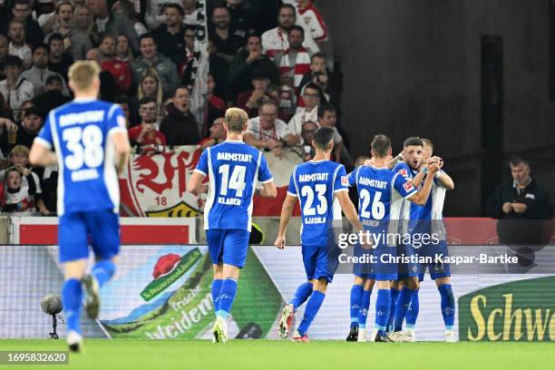Players of Darmstadt celebrate after Dan-Axel Zagadou of VfB Stuttgart scores their sides own goal during the Bundesliga match between VfB Stuttgart...