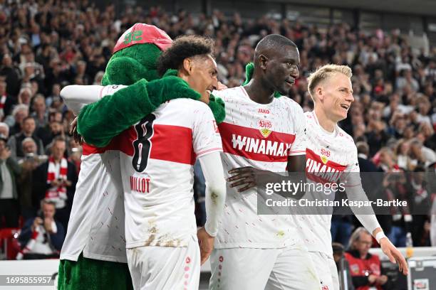 Sehrou Guirassy of VfB Stuttgart celebrates with team mates after scoring their sides second goal during the Bundesliga match between VfB Stuttgart...