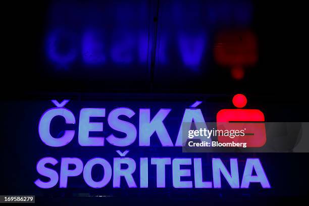 Logo sits illuminated at night outside a branch of Ceska Sporitelna AS, the Czech unit of Erste Group Bank AG, in Prague, Czech Republic, on Monday,...