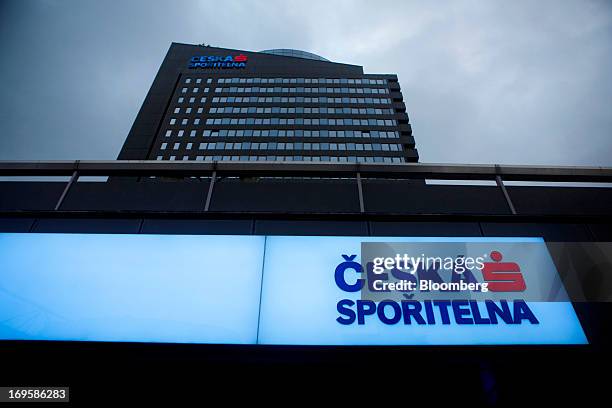 Logo sits illuminated at night outside the headquarters of Ceska Sporitelna AS, the Czech unit of Erste Group Bank AG, in Prague, Czech Republic, on...