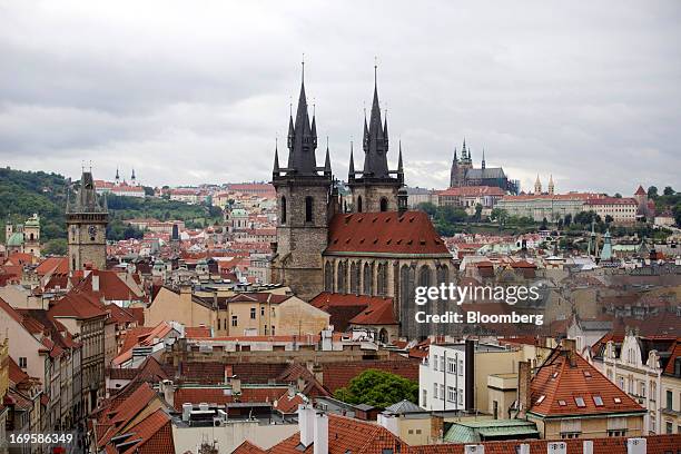 The church of Our Lady Before Tyn, center, and Prague cathedral, right, stand on the city skyline in Prague, Czech Republic, on Monday, May 27, 2013....