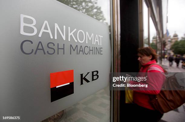 Customer uses an automated teller machine operated by Komercni Banka AS in Prague, Czech Republic, on Monday, May 27, 2013. Czech policy makers are...